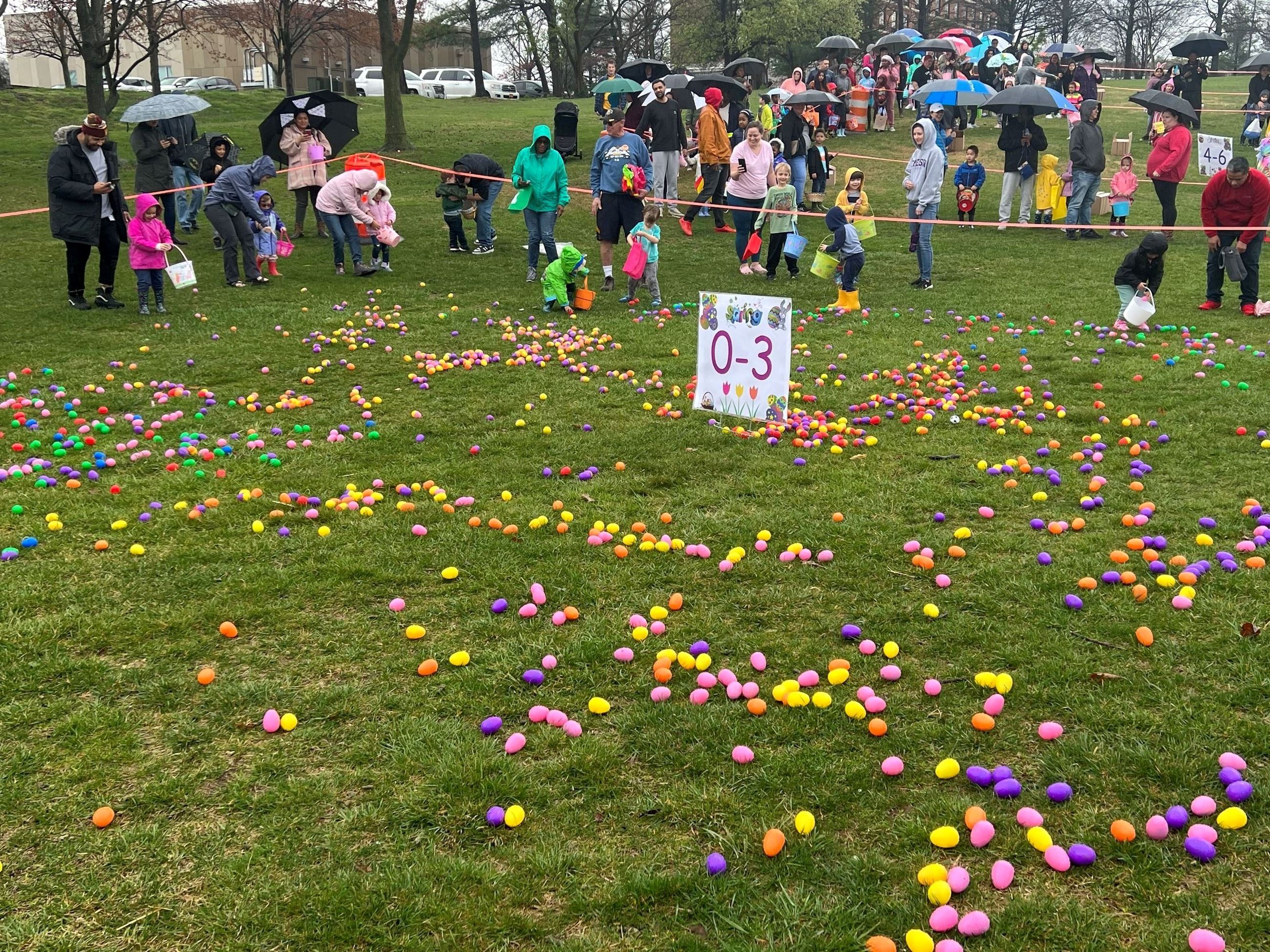 Kids collecting eggs at Eggstravaganza.