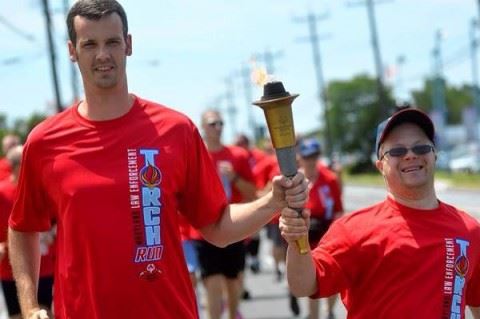 People Holding a Torch