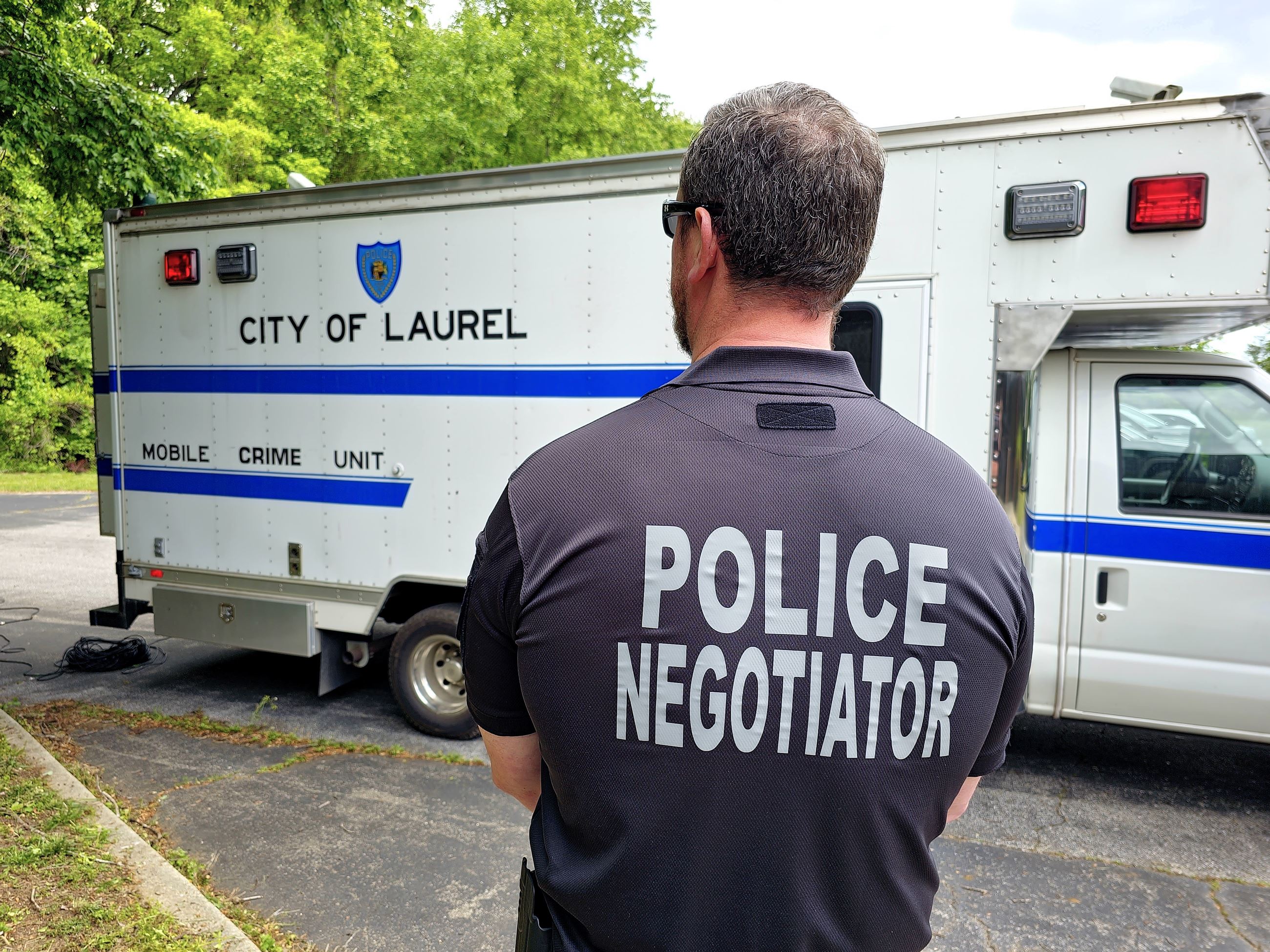 Back of police negotiator and truck